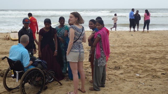 Dave speaking to local people on a beach in Goa