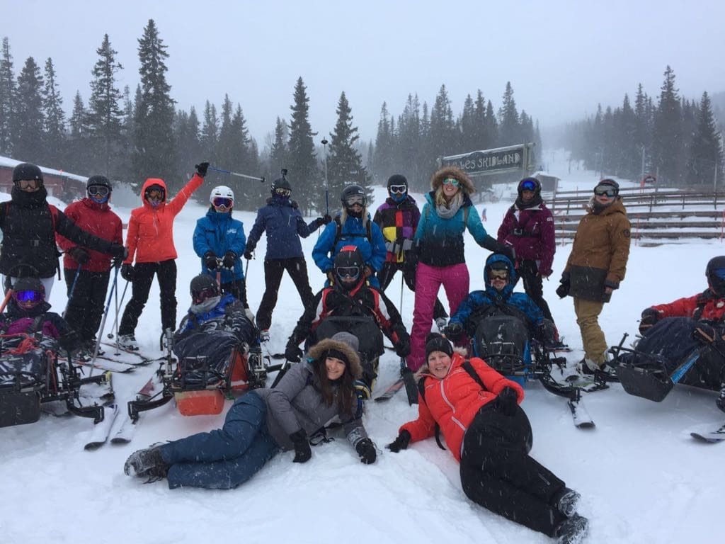 Back Up group posing for a photo out on a snowy slope