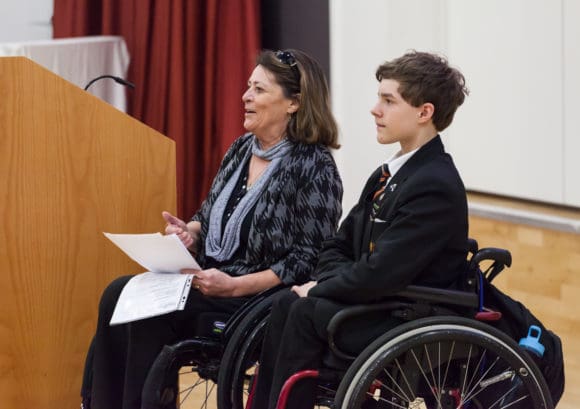 An education advocate and student - both with a spinal cord injury - giving a presentation to the school community