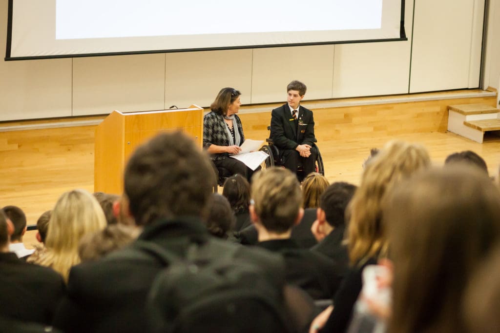 Kevin, one of our young volunteers, giving a talk on spinal cord injury at his school