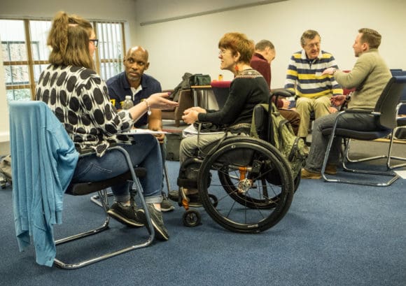 A group of volunteers talking at our mentor training in January 2017