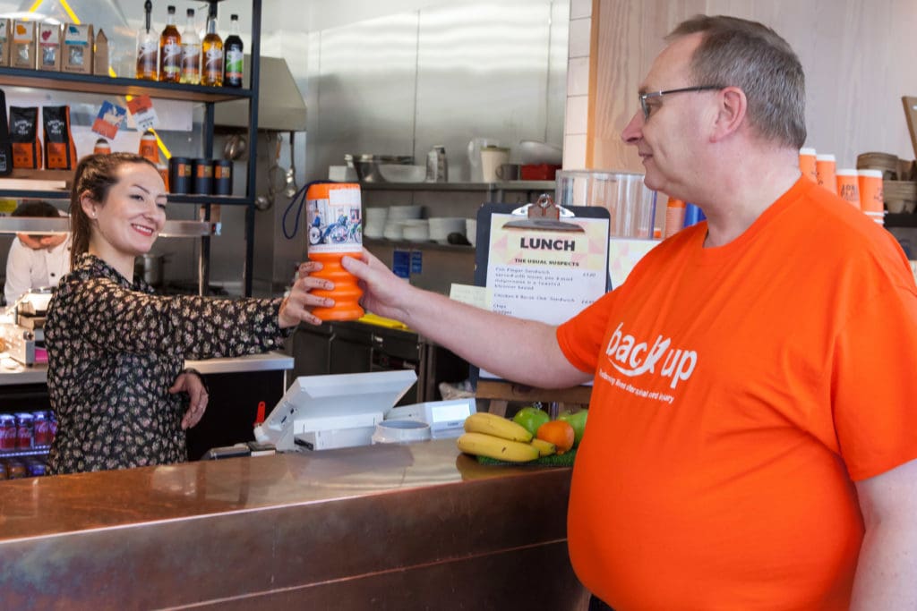 Alan fundraising for Back Up at a local cafe