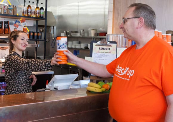 Alan fundraising for Back Up at a local cafe
