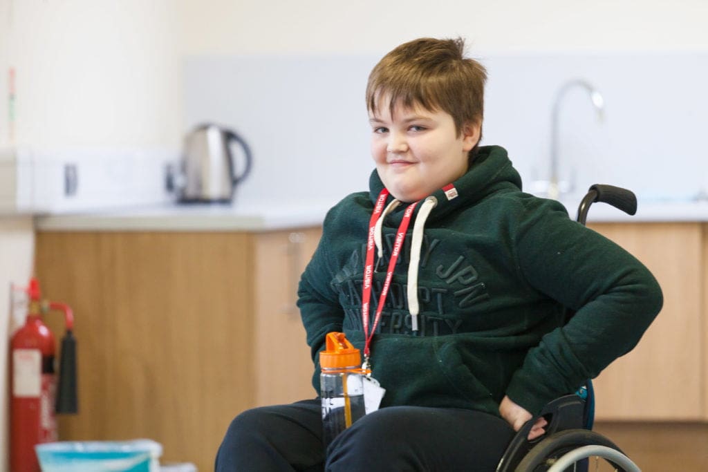 Young wheelchair user on a training weekend