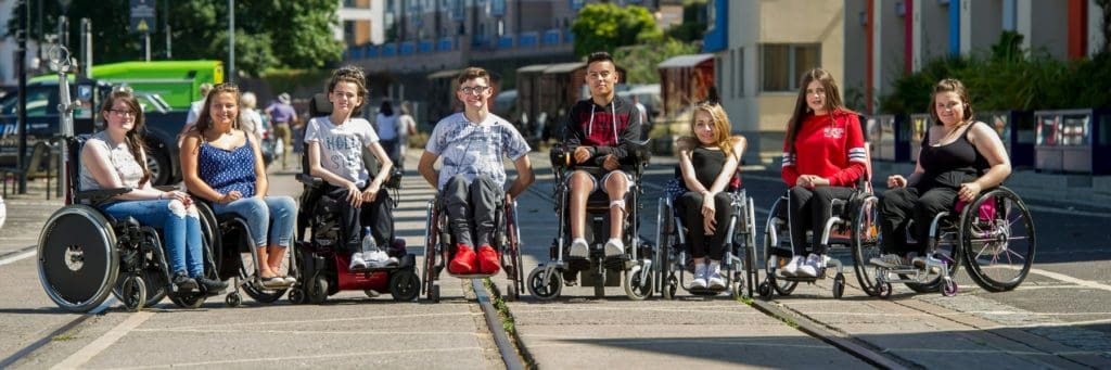 Group of young wheelchair users on our city skills course