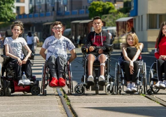 Group of young wheelchair users