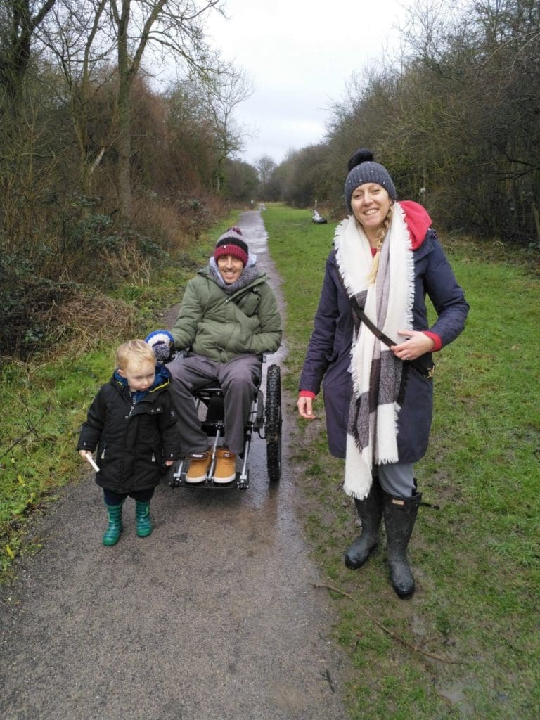 Chris and his family taking a walk near their home