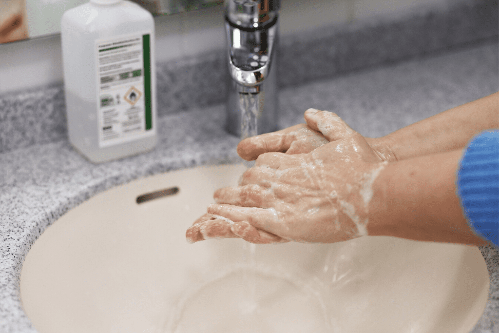 a person washing hands in line with coronavirus advice.