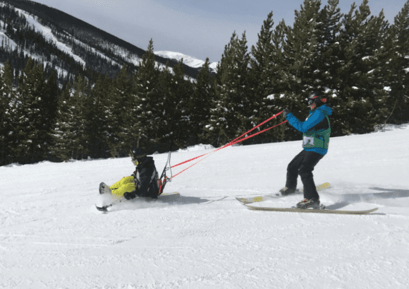 Ian sit skiing, enjoying some travel after spinal cord injuryy