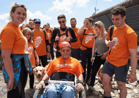 Tim and his family at the summit of mount snowdon after completing our Snowdon Push challenge