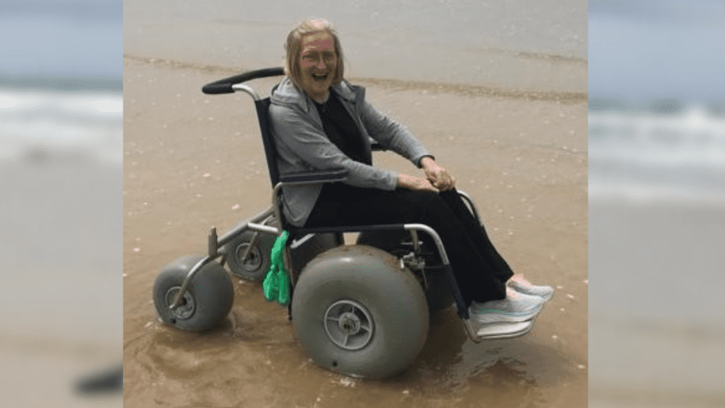 Jenny visiting a Beach using an adapted wheelchair