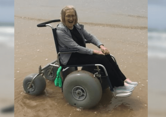 Jenny visiting a Beach using an adapted wheelchair