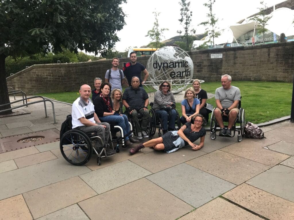 Group of 10 course participants together in the sunshine