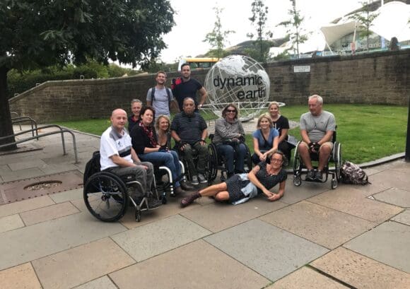 Group of 10 course participants together in the sunshine