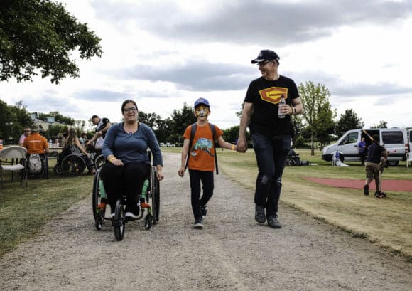 Photo of Mike and his son and wife enjoying family life at Back Up Fest