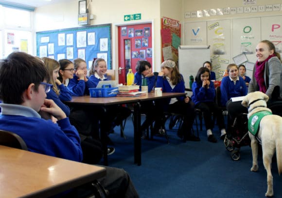 Education advocate giving talk to primary school children