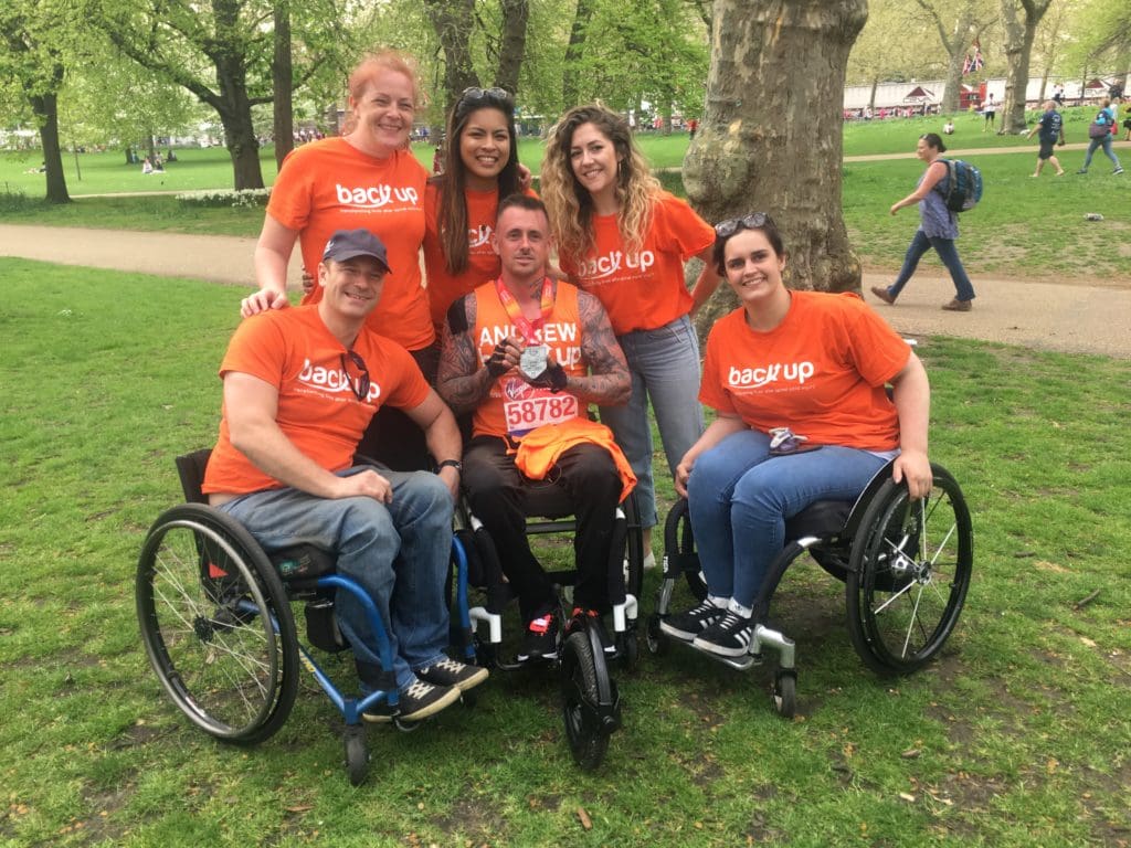 Andrew celebrates completing the London Marathon with some of our Back Up staff