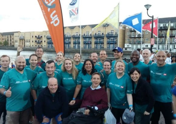 Andy and his colleagues smiling and laughing at the Dragon Boat Race