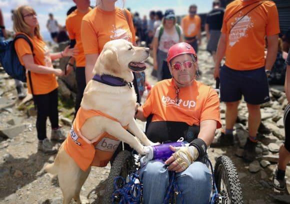 Our dear friend and volunteer, Tim Scott, at the top of Mount Snowdon with his assistance dog