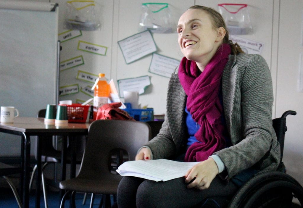 Education advocate leading a session at a primary school