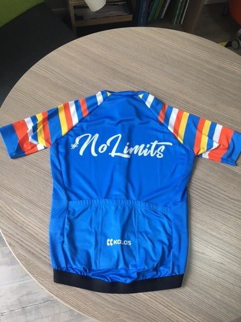 back of a blue #NoLimits cycling jersey with stripes on the sleeves