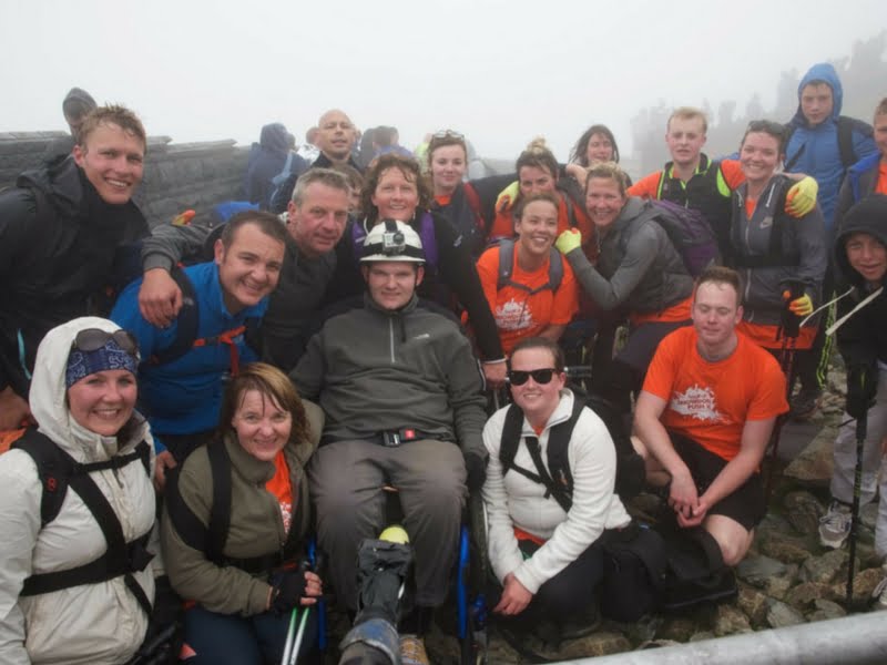 Joe at the top of Mount Snowdon with his Snowdon Push team