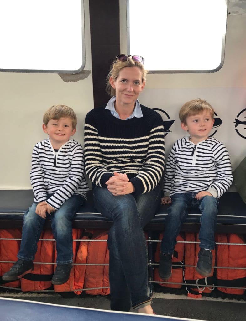 Kate and her two sons on a boat