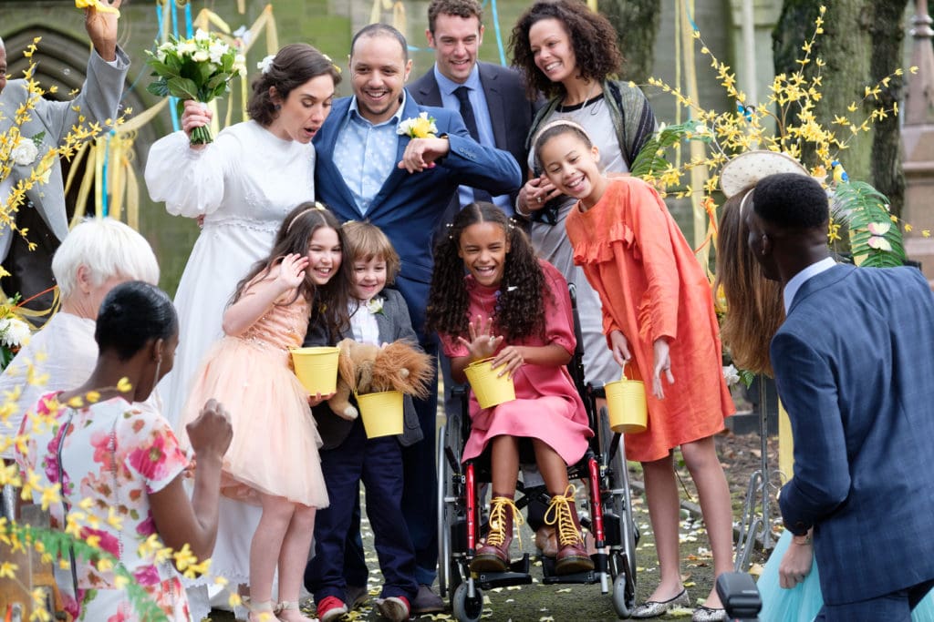 Photo of Katy and her family at a wedding