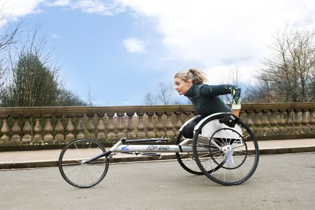 Melanie out in her racing chair, training for her marathon challenge