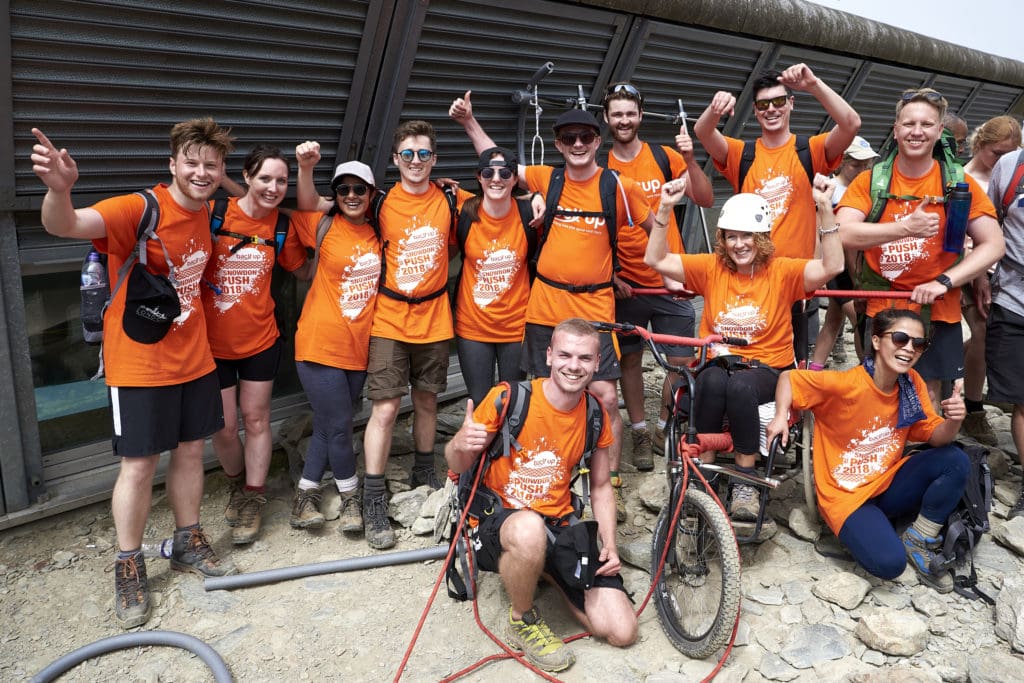 The "ACG Cliffhangers" team posing on Mount Snowdon during the Snowdon Push