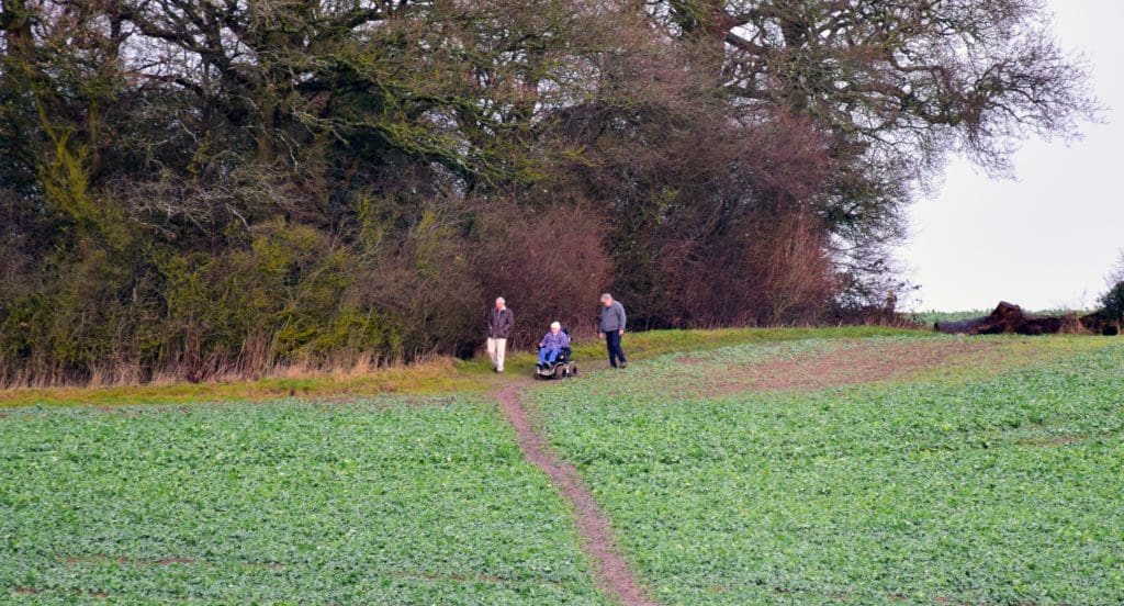 Penny and two companions taking a stroll through the countryside