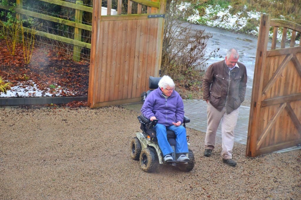 Penny and her husband George taking a stroll outside