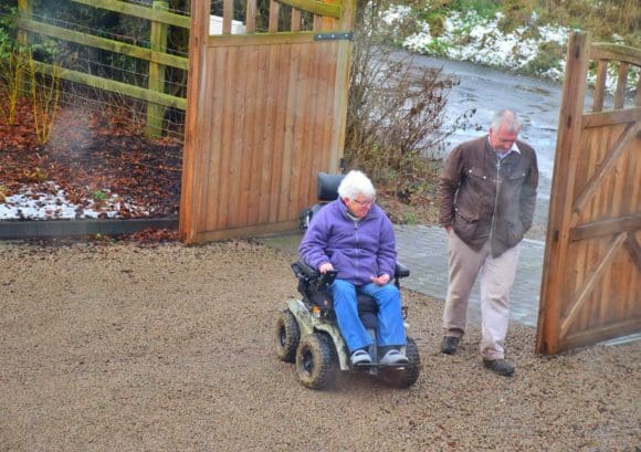 Penny and her husband George taking a stroll outside