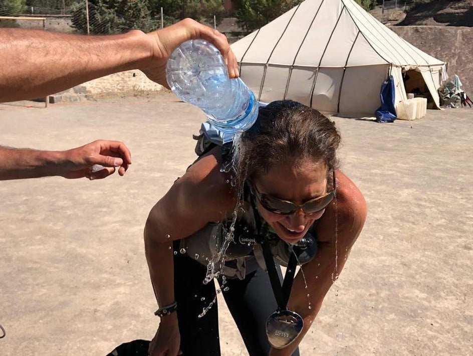 Someone pouring water over Rochelle after she finished her race