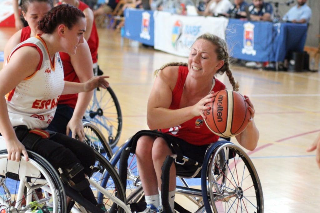 photo of Sophie playing wheelchair basketball