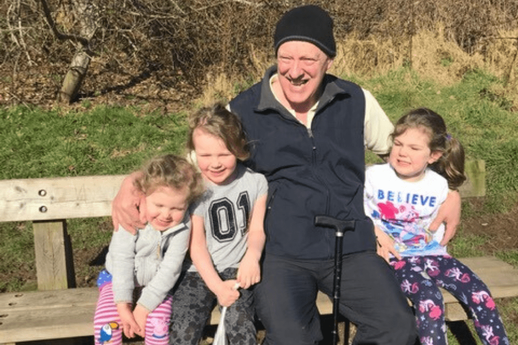 tom, a man who regained his independence after spinal cord injury,, sitting with his family