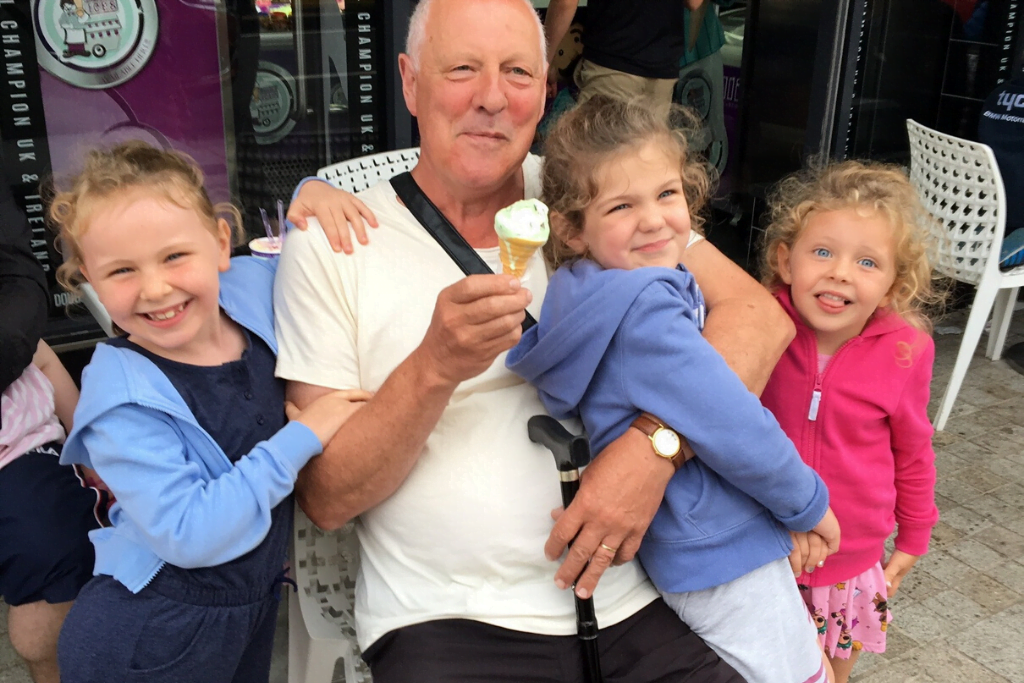 tom, a man who regained his independence after spinal cord injury,, sitting with his family