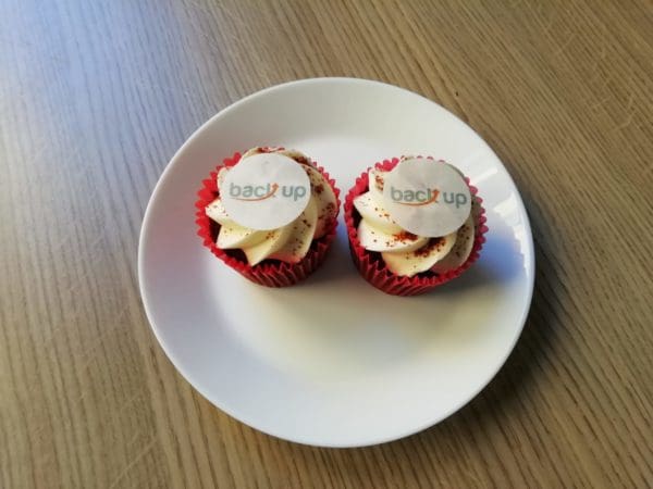 two cupcakes with Back Up cake toppers on them