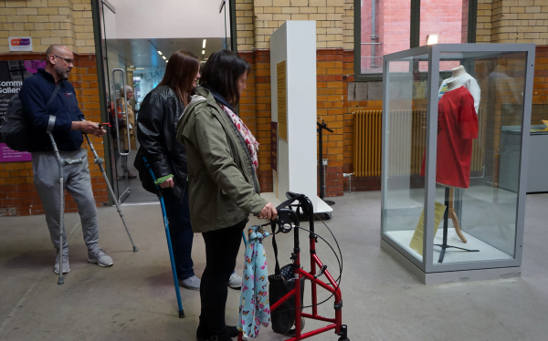 A group of spinal cord injured participants exploring the People's History Museum