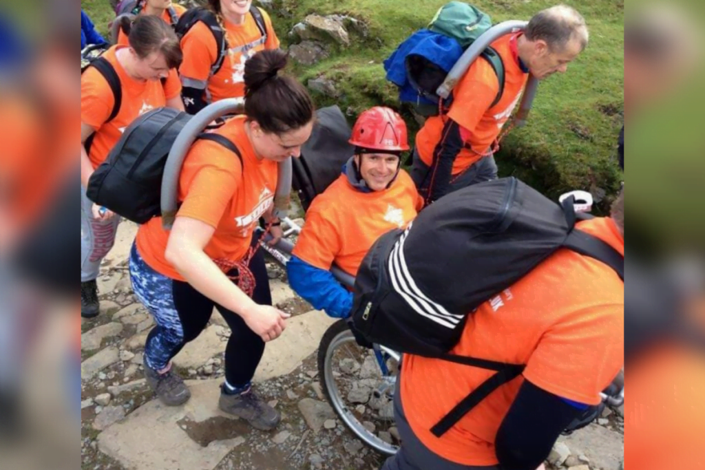 Sean taking on our snowdon push challenge after we helped him with family mentoring after spinal cord injury