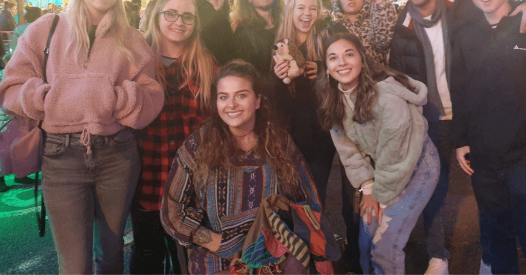Maisie surrounded by friends at university