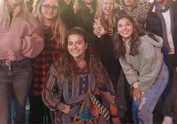 Maisie surrounded by friends at university