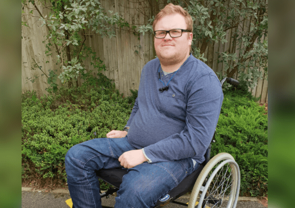 Callum, who back uo helped return to work after spinal cord injury, outside