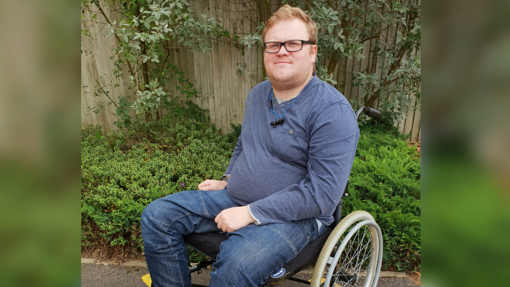 Callum, who back uo helped return to work after spinal cord injury, outside