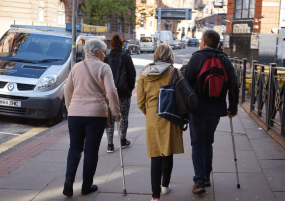 A group of our course participants alking through Manchester