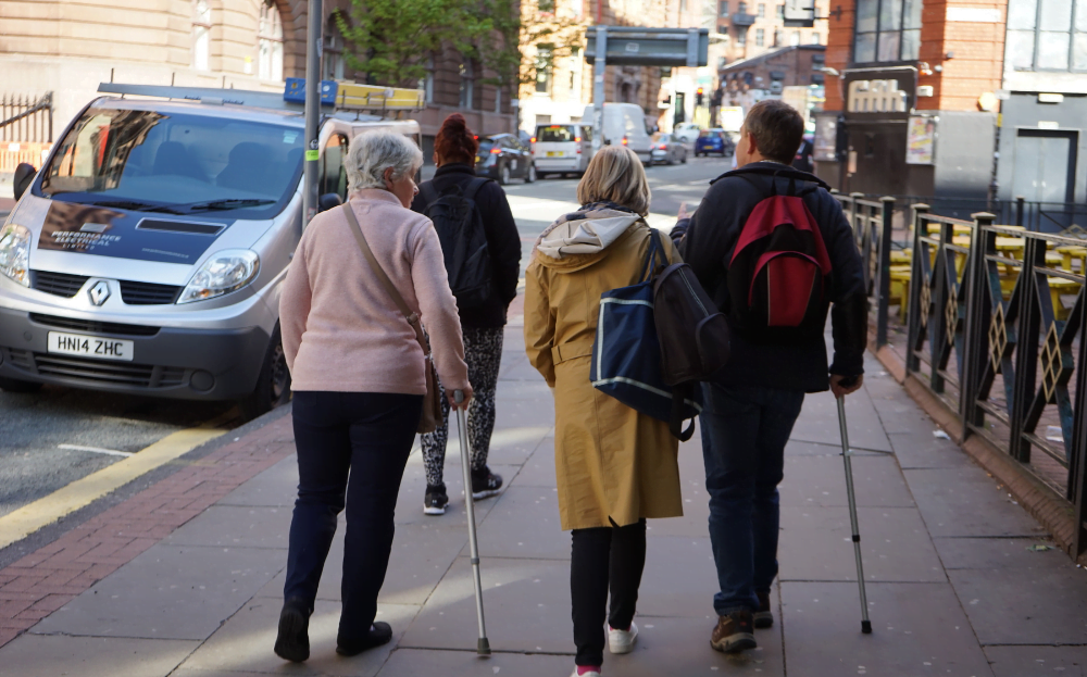 A group of our course participants alking through Manchester