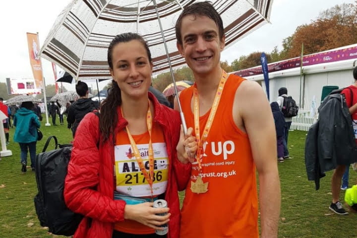 Our Back Up champion Alice and her boyfriend Henry stand at the end of the Royal Parks Half Marathon, wearing their medals.