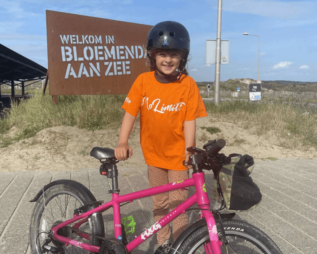 Photo of Rona with her bike in the Netherlands.