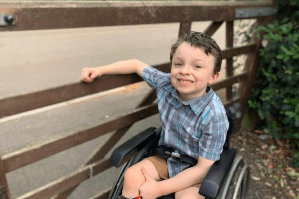 Emerson, a young wheelchair user, spending some time outside. BBC Children in Need worked with us to tell his story.