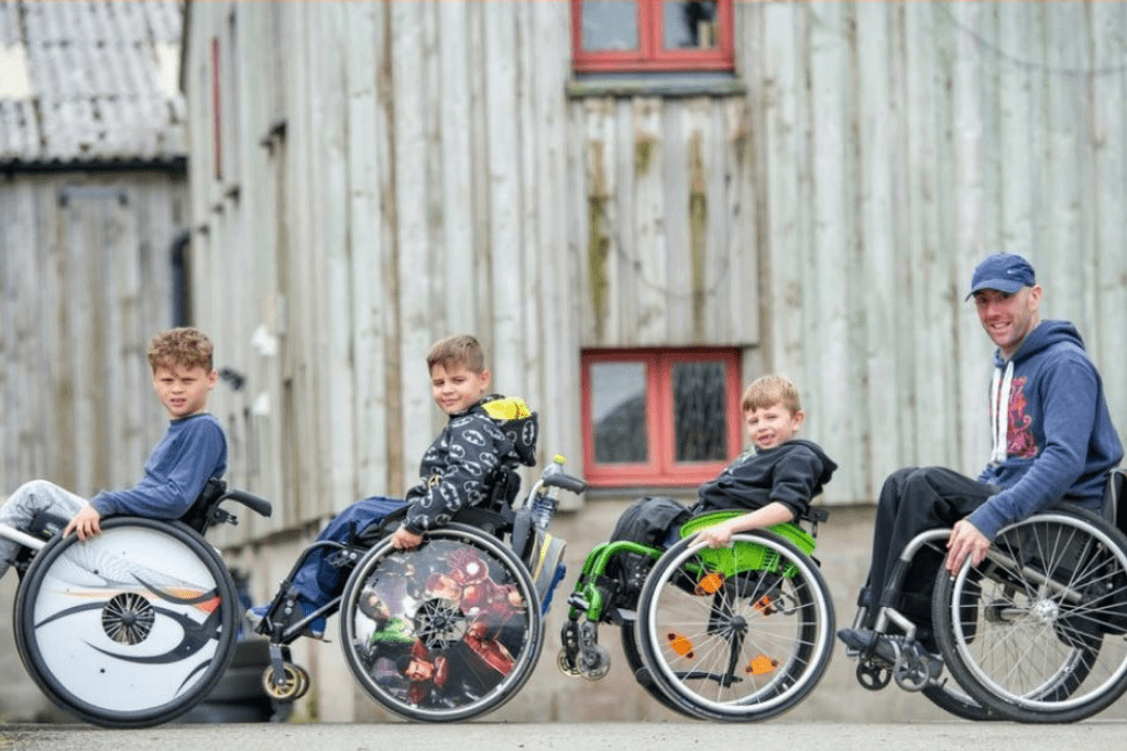 David teaching a group of young people how to back wheel balance